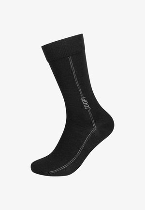 Schwarze Socke aus weichem, gestricktem Material. Verfügt über einen gerippten Saum, eine verstärkte Ferse und ein hellgraues Logo an der Seite mit einem Stichmuster.