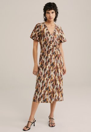 Wrap dress in a multicolored animal print, featuring short flutter sleeves, a knotted detail at the waist, and a mid-length hem.