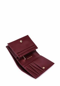 Burgundy leather wallet with gold hardware, multiple card slots, a coin pocket, and a snap closure. Smooth texture and compact design.