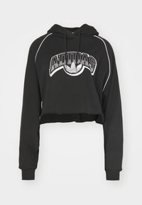 Czarna krótka bluza z miękkiego materiału z kapturem na sznurek i białymi akcentami. Na przedzie wyraźne logo "Adidas".