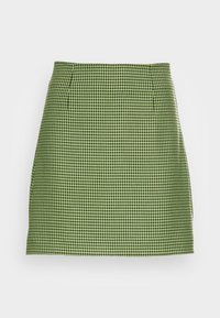 Jupe à carreaux houndstooth verts avec une coupe droite et des plis, présentée sur un fond blanc uni.