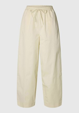 Pantaloni crema larghi con elastico in vita e coulisse frontale, realizzati in tessuto leggero.
