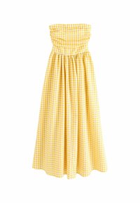 Gul rutigt strapless klänning med en smocked bodice och flödande kjol. Har en samlad midja och textil av bomull.