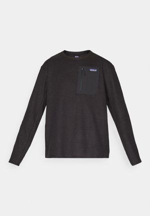 Black long-sleeve crewneck fleece with textured fabric and zippered chest pocket featuring Patagonia logo.
