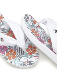 White flip-flops with a tropical floral print featuring orange and pink flowers, knotted straps, and a smooth, textured sole.