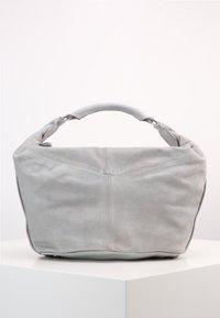Gray leather bag with a soft, textured surface; features a rounded handle and a structured base. Back has a minimalistic seam detail.