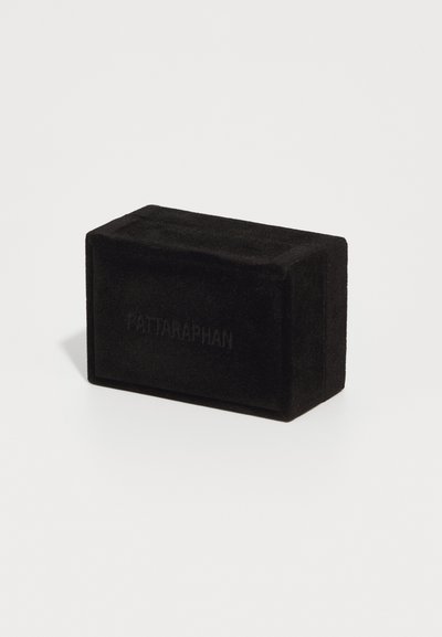 Black rectangular box made of soft, velvety material, featuring embossed text. The surface is smooth with no visible hardware or patterns.