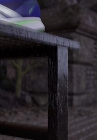 Blue sneaker with "Adizero SL 2" text on the heel resting on a black wooden table edge outdoors at dusk.