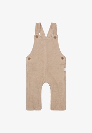 Beige badstof overall met verstelbare banden, houten knopen, twee zijzakken en een ronde uitsparing voor de benen.