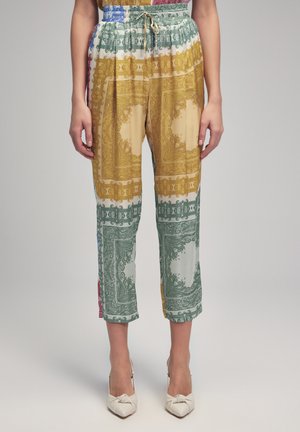 Multicolored patterned pants with a drawstring waist, featuring intricate designs in gold, green, and blue on a light background.
