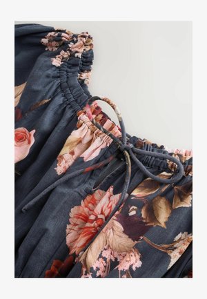 Floral fabric blouse with a dark blue background, featuring pink and rose patterns, an elastic neckline, and a drawstring accent.
