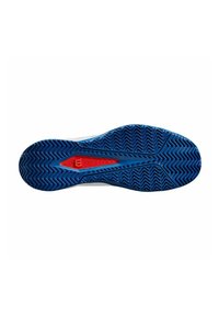Suela de zapato de goma azul con un patrón de espiga texturizado, con un acento rojo en el centro y un borde blanco liso.