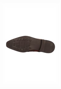 Suela de zapato de cuero marrón con una suela de goma con patrón, que presenta un diseño plano, secciones con agarre texturizado y un área de tacón suave.
