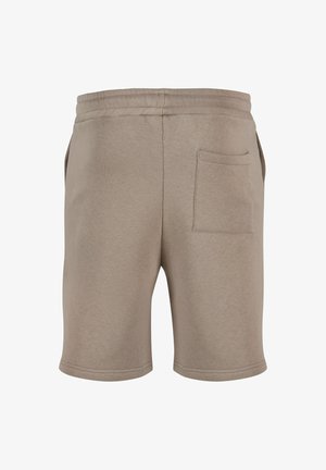 Beige cotton shorts with an elastic waistband, featuring a single back pocket and a smooth texture. Hem finishes are clean and simple.