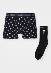 Fekete boxer alsónadrág fehér Karl Lagerfeld logónyomattal, valamint fekete zoknik hasonló logóval és karakterdizájnnal. Pamut keverék.