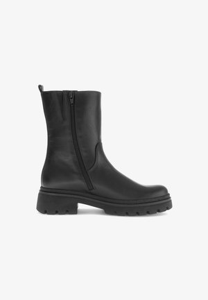 Zwarte leren enkelboots met rits, ronde neus en chunky rubberen zool met een gestructureerd profiel voor grip.