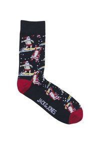 Chaussettes noires ornées de motifs colorés de personnages de surf et de flocons de neige. Accents rouges sur le bout et le logo au niveau de la cheville.