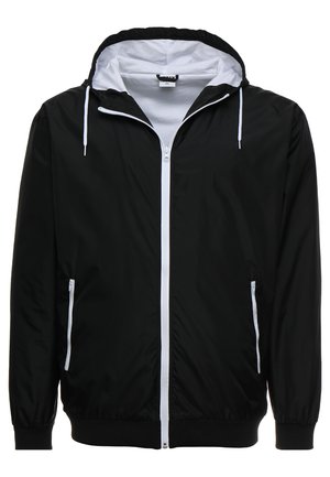 Veste légère noire avec un intérieur blanc. Comprend une fermeture éclair intégrale, deux poches latérales, une capuche ajustable avec cordon de serrage et des poignets élastiques.