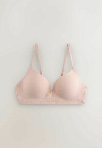 Vaaleanpunainen topattu rintaliivi säädettävillä ohuilla olkaimilla, sileillä kupilla ja leveällä joustavalla alareunuksella yksinkertaisella vaalealla taustalla.