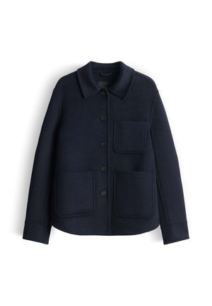 Navy blue wool jacket with a collared neck, seven-button front, and two large front pockets. Soft texture, structured shape, and modern design.