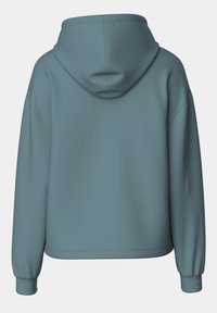 Felpa con cappuccio in teal spento con una texture liscia, vestibilità ampia, spalle ribassate e polsini a coste. Presenta una classica tasca a marsupio.