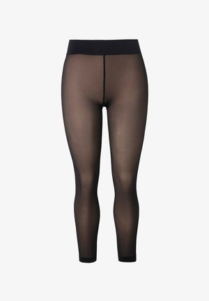 Czarne, przezroczyste legginsy z szerokim pasem, gładką fakturą, półprzezroczystym materiałem i długością do kostek. Posiadają detal w postaci środkowego szwu.