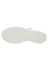 White rubber shoe sole featuring a textured zigzag pattern, with a smooth rounded toe and integrated branding label.