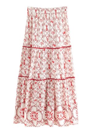 Jupe blanche à volants avec imprimés rouges de homard et d'ananas et bordure rouge ondulée séparant chaque niveau.
