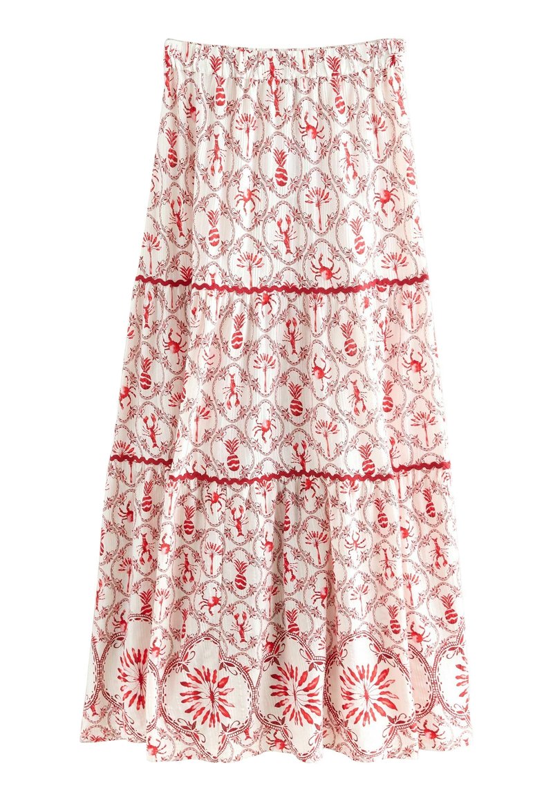 Jupe blanche à volants avec imprimés rouges de homard et d'ananas et bordure rouge ondulée séparant chaque niveau.