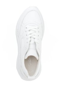 White athletic sneaker with leather texture, rounded shape, and lacing system. Features soft inner lining and minimal branding on the tongue.