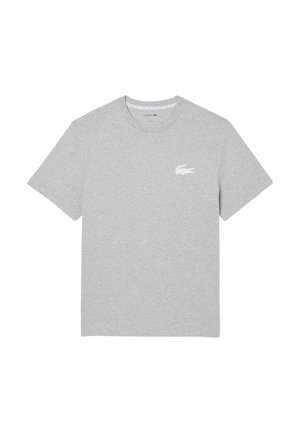 T-shirt grigio in cotone con maniche corte, colletto rotondo e un piccolo logo bianco di coccodrillo sul lato sinistro del petto. Tessuto liscio su tutta la superficie.