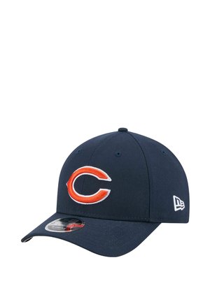 Navy cap made of fabric with a curved brim. Features a white and orange embroidered "C" logo on the front and a small brand logo on the side.