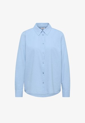 Lyseblå struktureret langærmet skjorte med knapper, spids krave og klassiske manchetter, mærket "Cecil" inde i kraven.