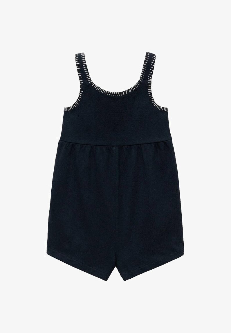 Marinblå jumpsuit med tunna axelremmar, en figursydd kropp och en utsvängd nederdel. Har vit sömnad längs axelremmarna och midjan.