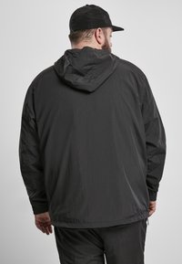 Urban Classics Ulkoilutakki - black