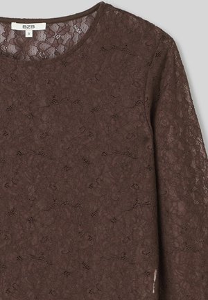 Haut en dentelle marron avec un col rond et des manches longues, orné de motifs floraux et d'une finition douce et texturée. Taille S.