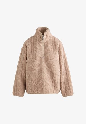 Beige fleece pullover with a high collar and zippered neck. Features textured patterns resembling snowflakes and cable knit. Soft, warm fabric.