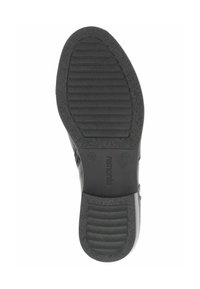 Semelle de chaussure en caoutchouc noir dotée de rainures et de crêtes texturées pour une meilleure traction. Comprend un détail de marque et une zone de talon lisse.