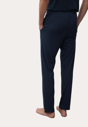 Pantalones de chándal para hombre en azul marino, hechos de un tejido suave, con un corte relajado, bolsillos laterales y una cinturilla elástica.