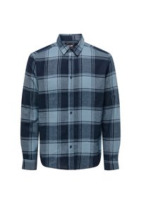 Camisa de manga larga con botones, de gran patrón a cuadros en navy y azul claro, con cuello extendido y puños abotonados sobre un fondo blanco liso.