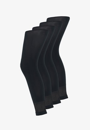Sorte benvarmere lavet af strækbart materiale, med en glat tekstur og elastiske manchetter med cirkulære hardware-detaljer ved bunden.