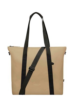 Tote bag in beige, made of durable material with black adjustable straps. Features a zipper closure and branding on the front.