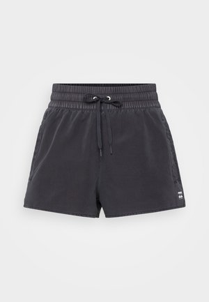 Sorte badetights laget av lett stoff, med elastisk midje og snor, sidelommer og logo-detalj.