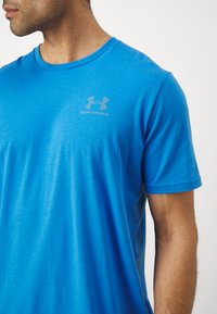 Under Armour LEFT CHEST LOGO - Print T-shirt - blue atlantis/blue calm