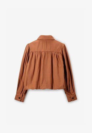 Rostfarbenes Bluse mit langen Ärmeln, gefaltetem Rücken, Knopfmanschetten und einem Kragen. Hergestellt aus einem weichen Stoff mit einer strukturierten Oberfläche.