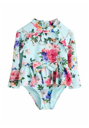 Ilgomis rankovėmis kūdikių maudymosi kostiumėlis su pasteliniu mėlynu fonu, spalvingu gėlių raštu, sijoniuku liemens srityje ir priekine kaspinėlio detale.