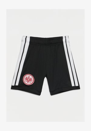 Czarne krótkie spodenki sportowe z białymi paskami po bokach i czerwonym okrągłym emblematem przedstawiającym stylizowanego orła na lewej nodze.