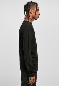 Urban Classics Džemper - black