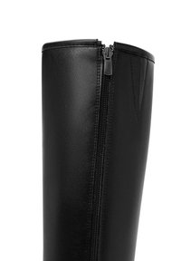Black leather knee-high boot featuring a full-length zipper on the side and a smooth texture with a subtle sheen.