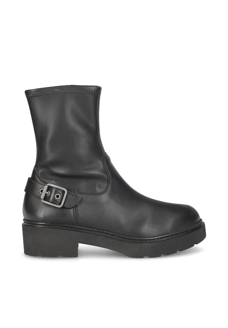 Bottine en cuir noir avec un bout rond, texture lisse et détail de boucle sur le côté. Elle présente une semelle épaisse et un minimum de couture.